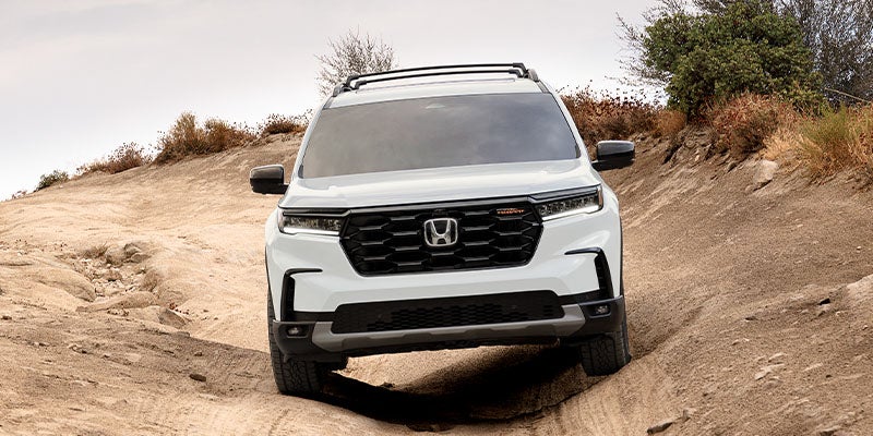 Honda Pilot TrailSport articulating on rugged off-road trail