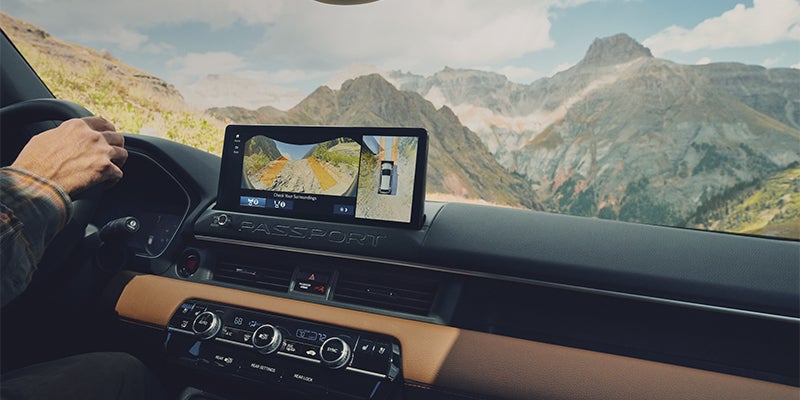 Honda TrailWatch multi-camera dashboard display navigating mountain trail obstacles
