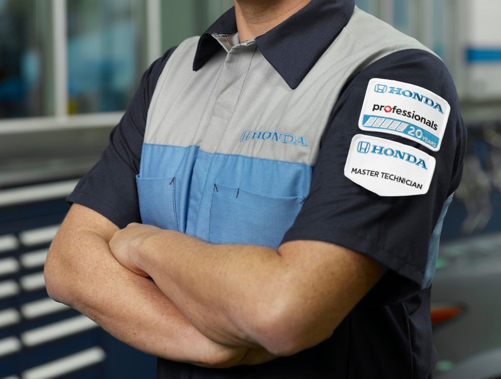 Honda certified service technicians performing vehicle maintenance at Fremont Honda of Casper