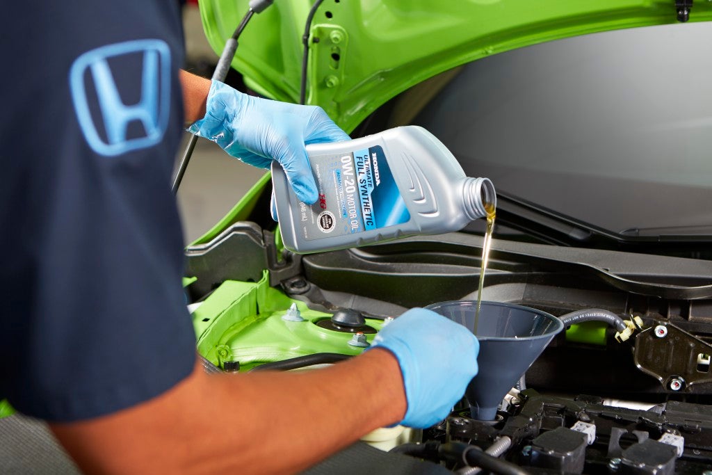Service bay vehicle inspection and maintenance at Fremont Honda of Casper